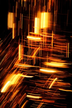 Abstract display of blazing sparks and streaks of light that appear to be in motion, creating an energetic and dynamic composition against a dark background.