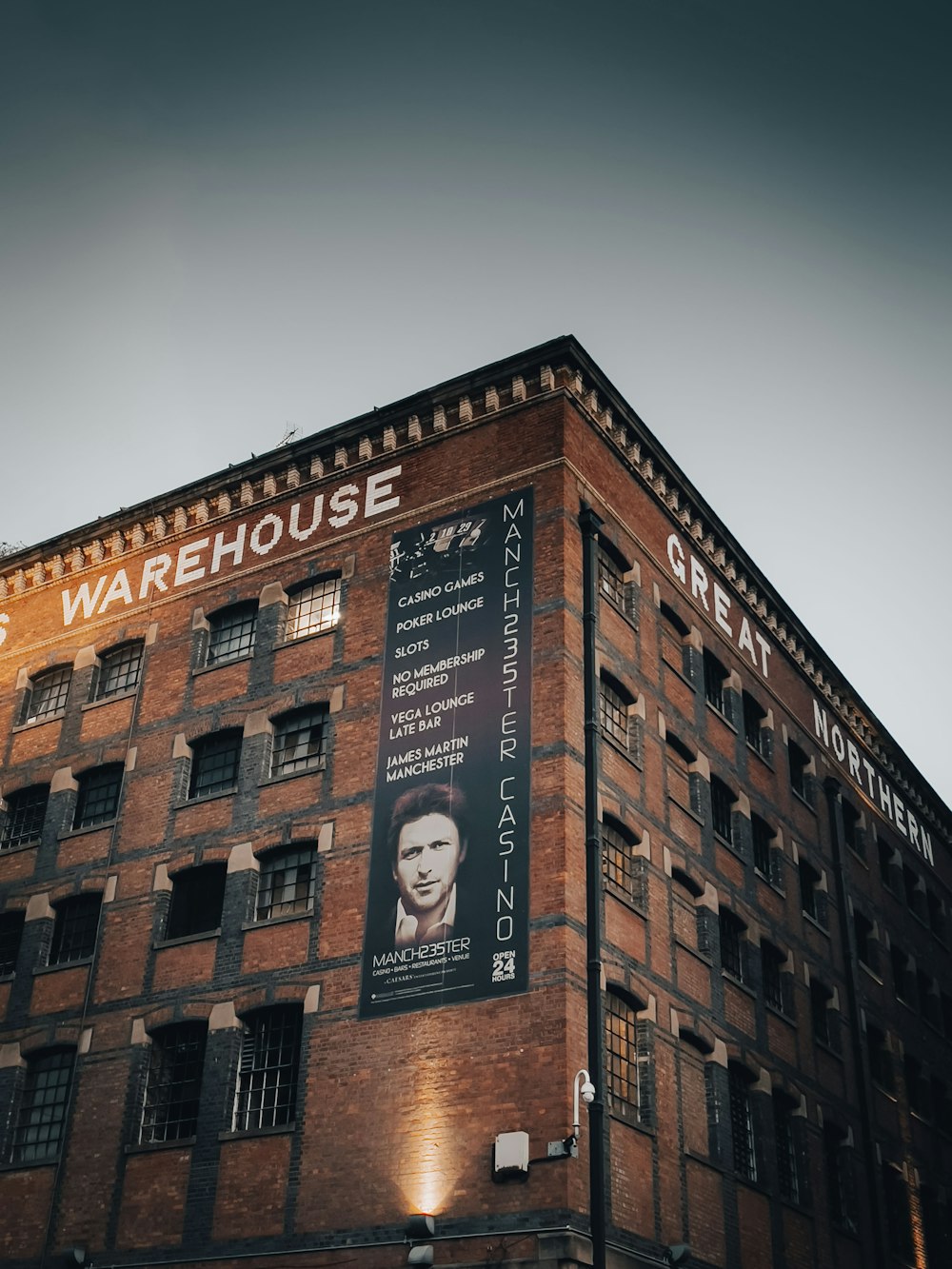 a large brick building with a sign on it