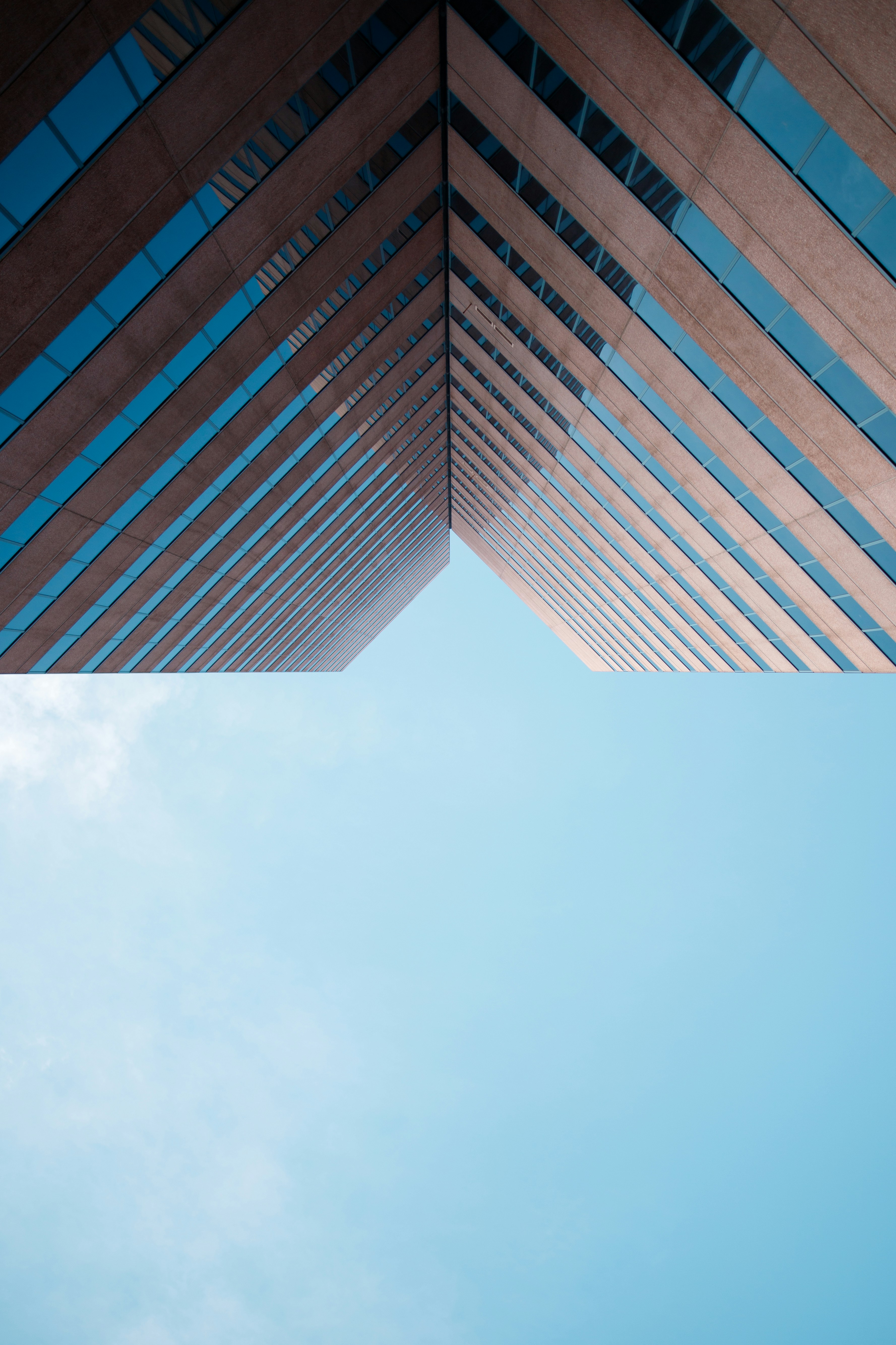 a tall building with a blue sky