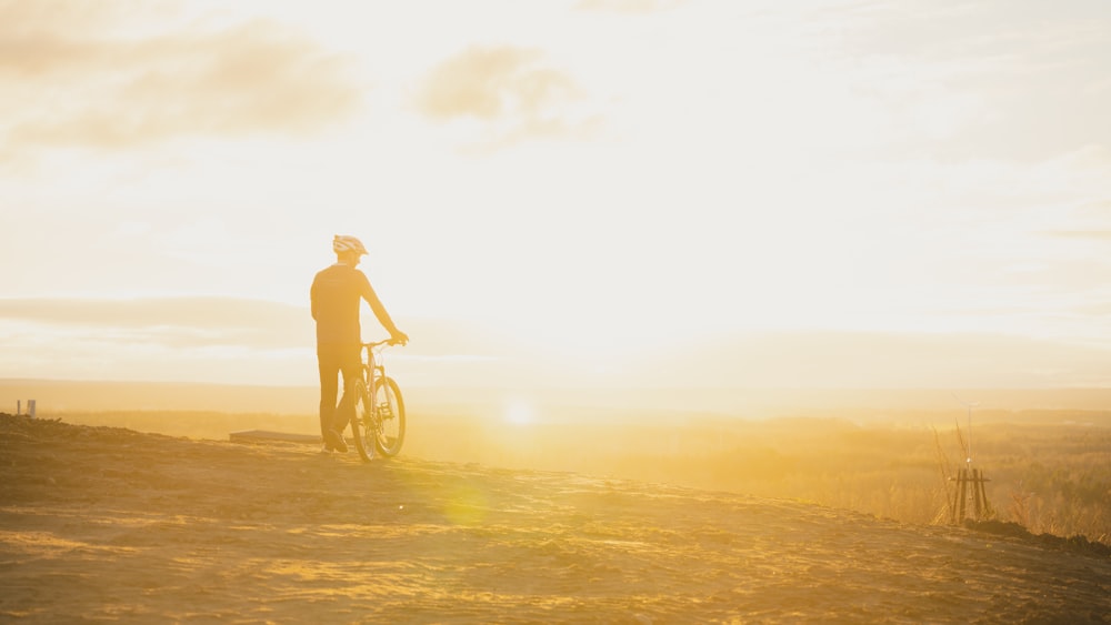 a person on a bicycle in a field