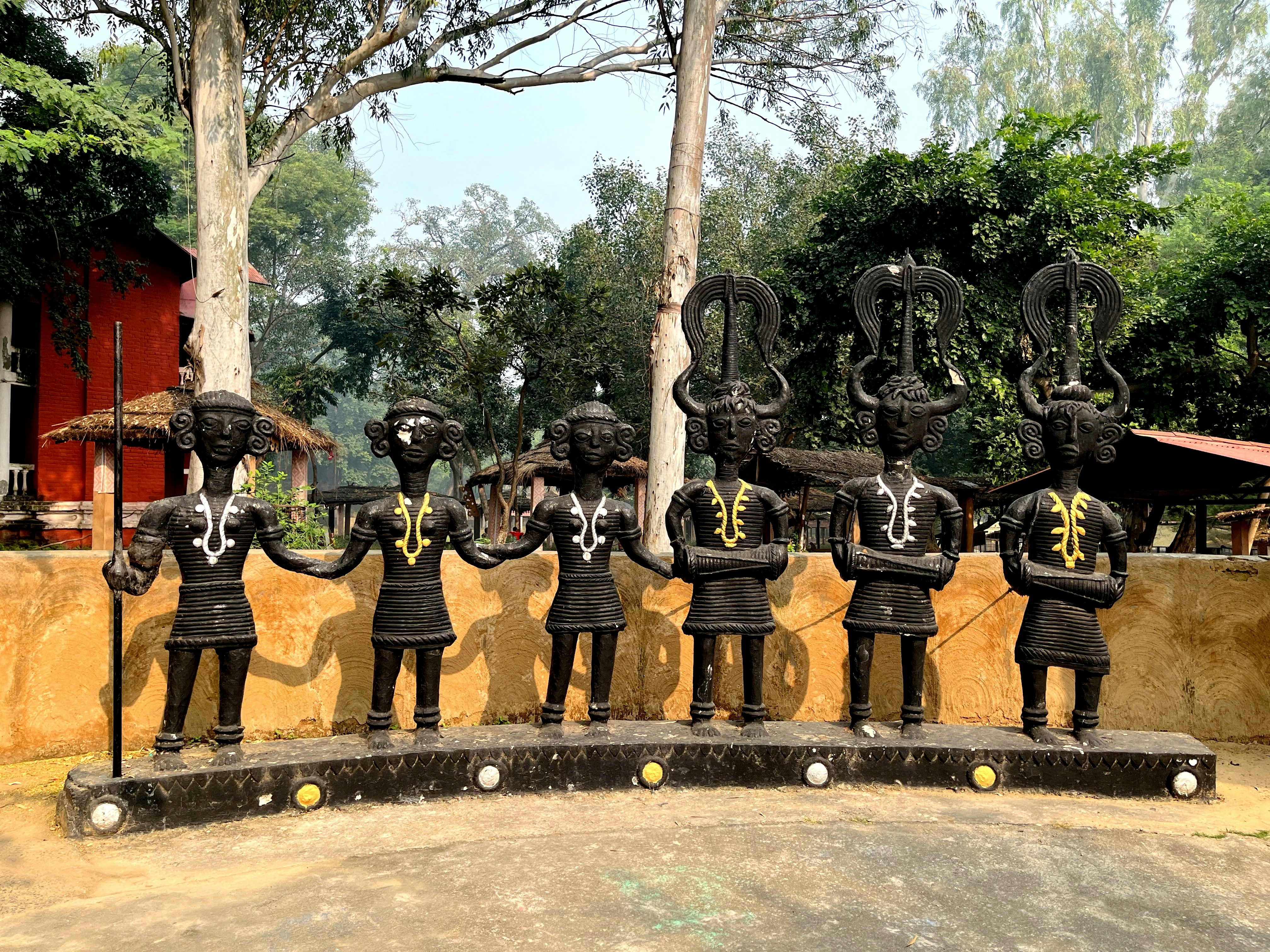 a group of statues of men in black uniforms