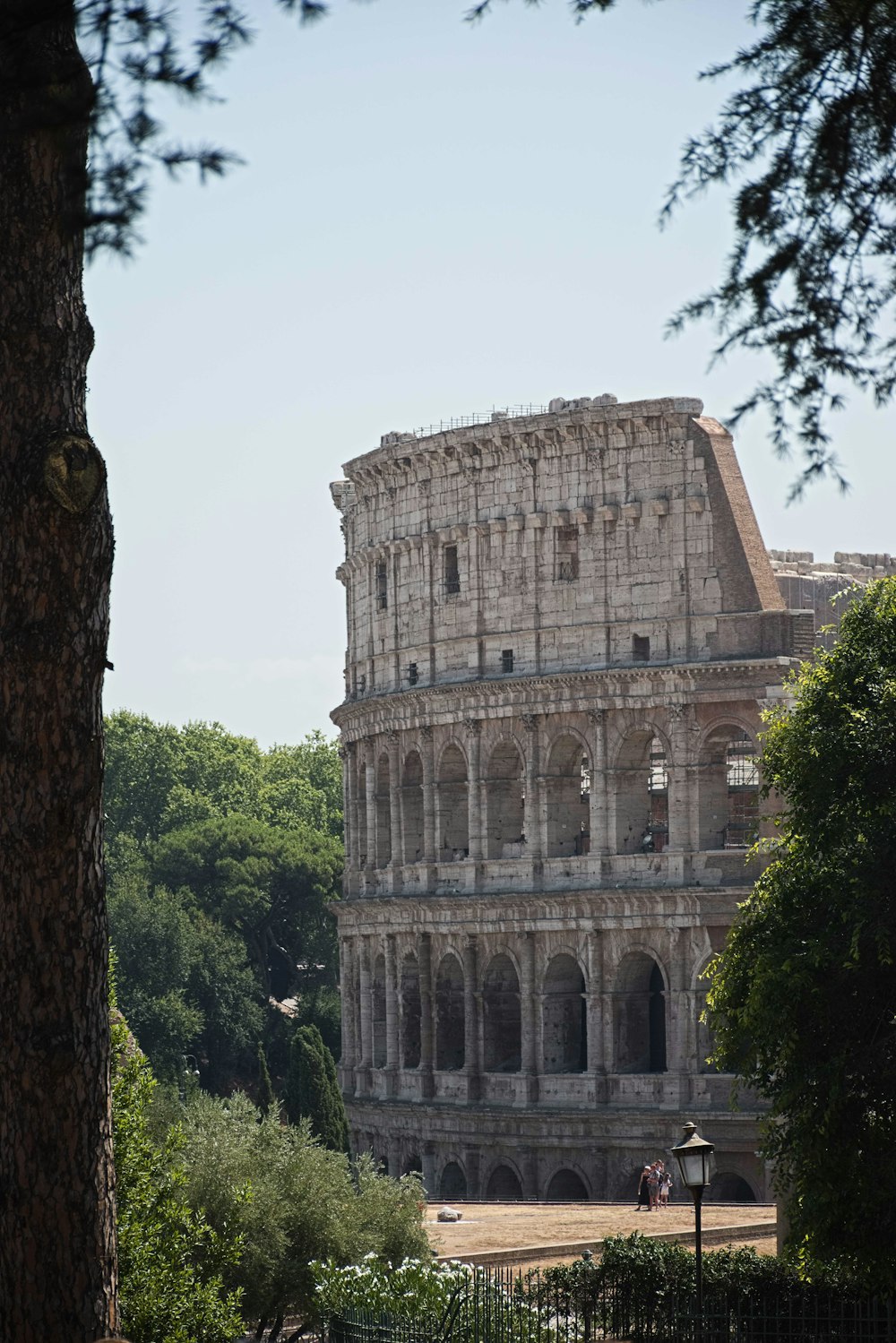 a stone building with trees around it