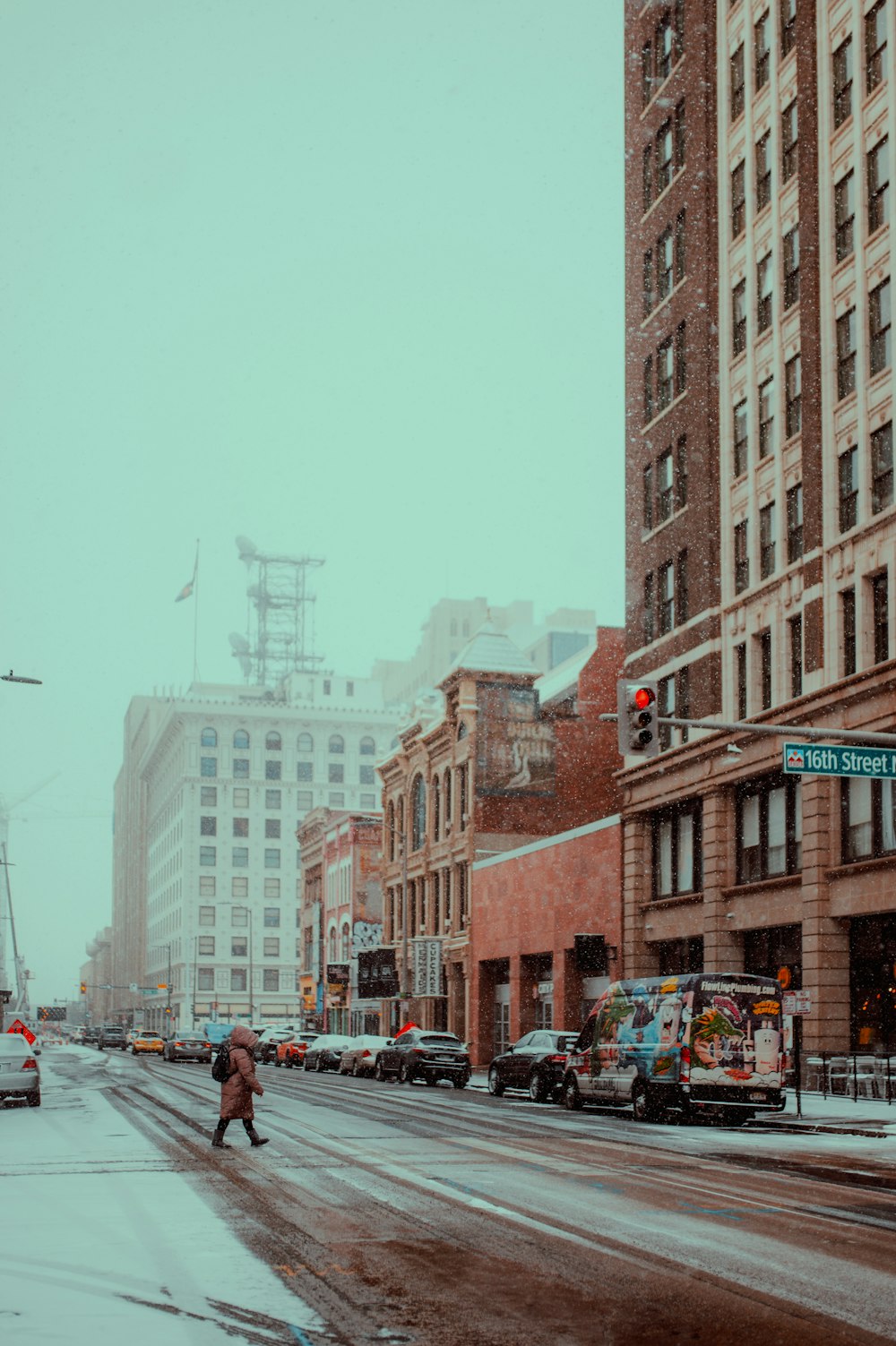 a person walks across a street