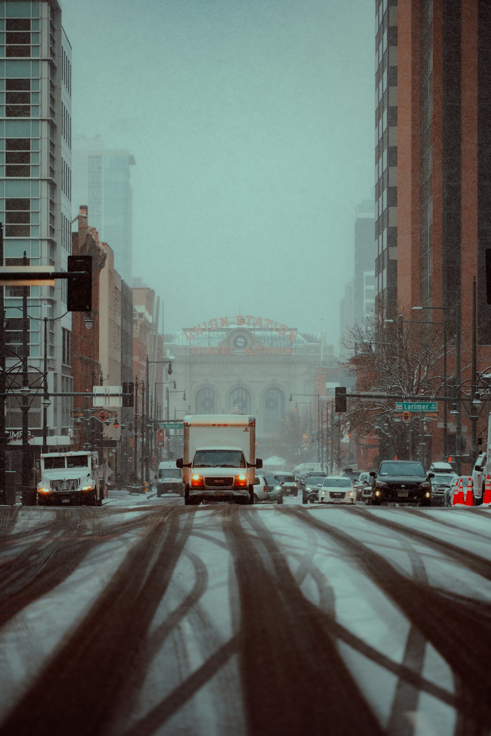 a city street with cars and trucks