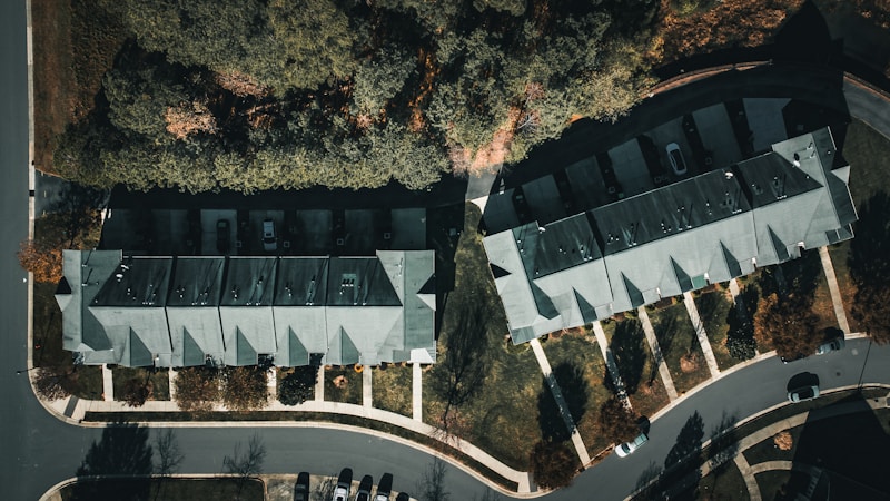 Aerial drone view of luxury estate with courtyard and grounds