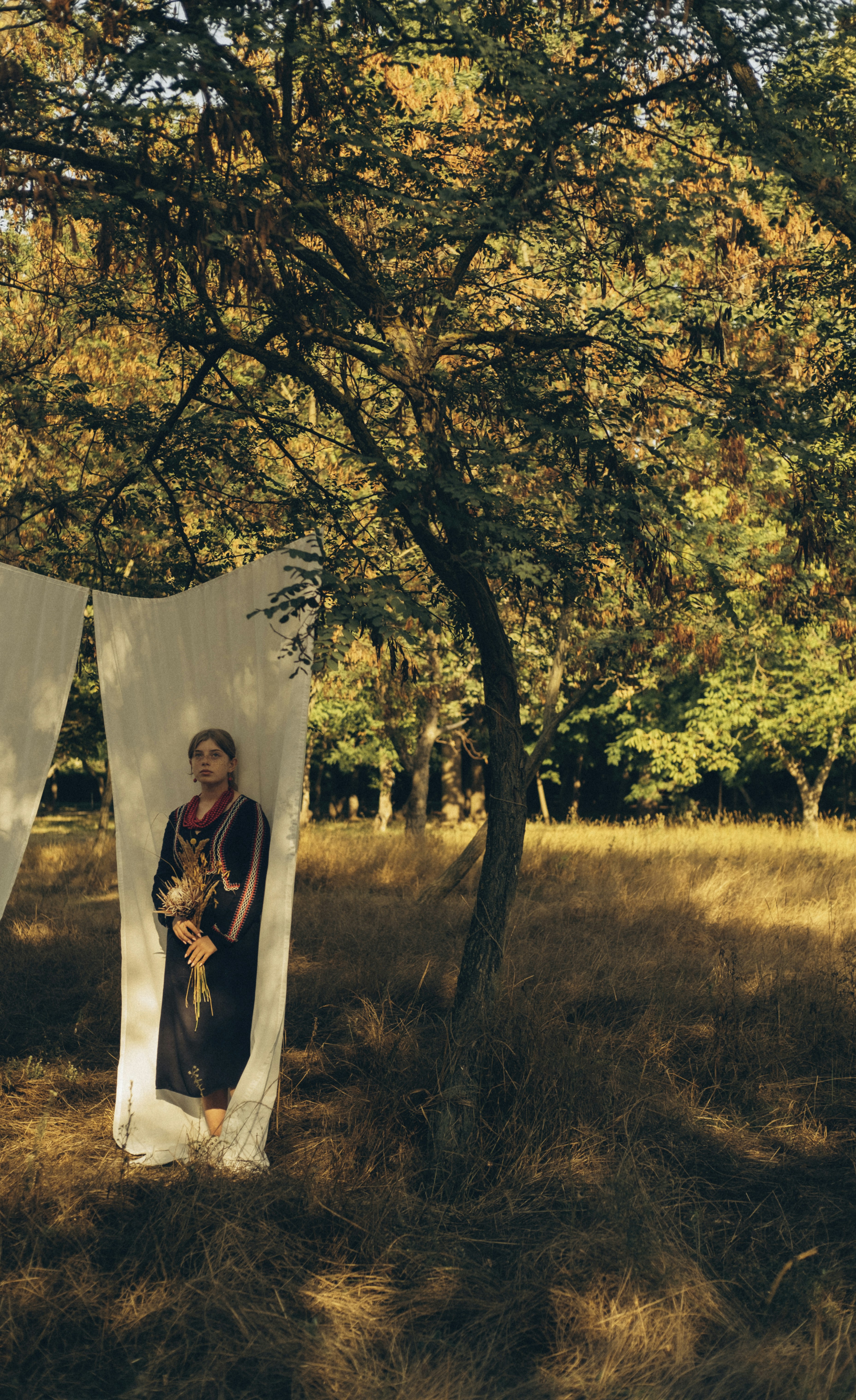 a man standing next to a tent