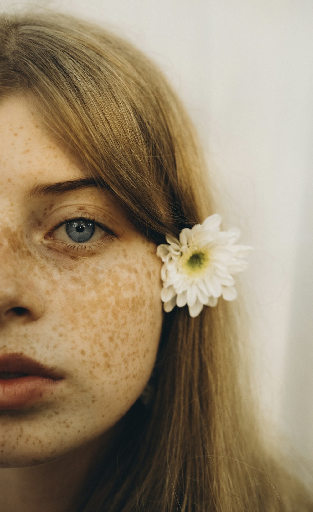 a woman with a flower in her hair