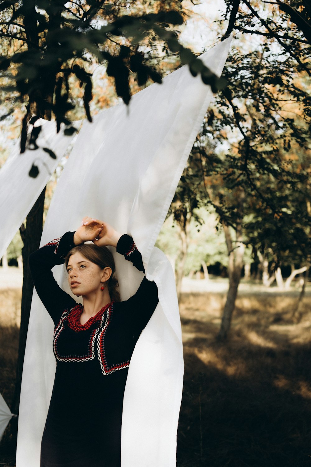 a person holding a tree branch