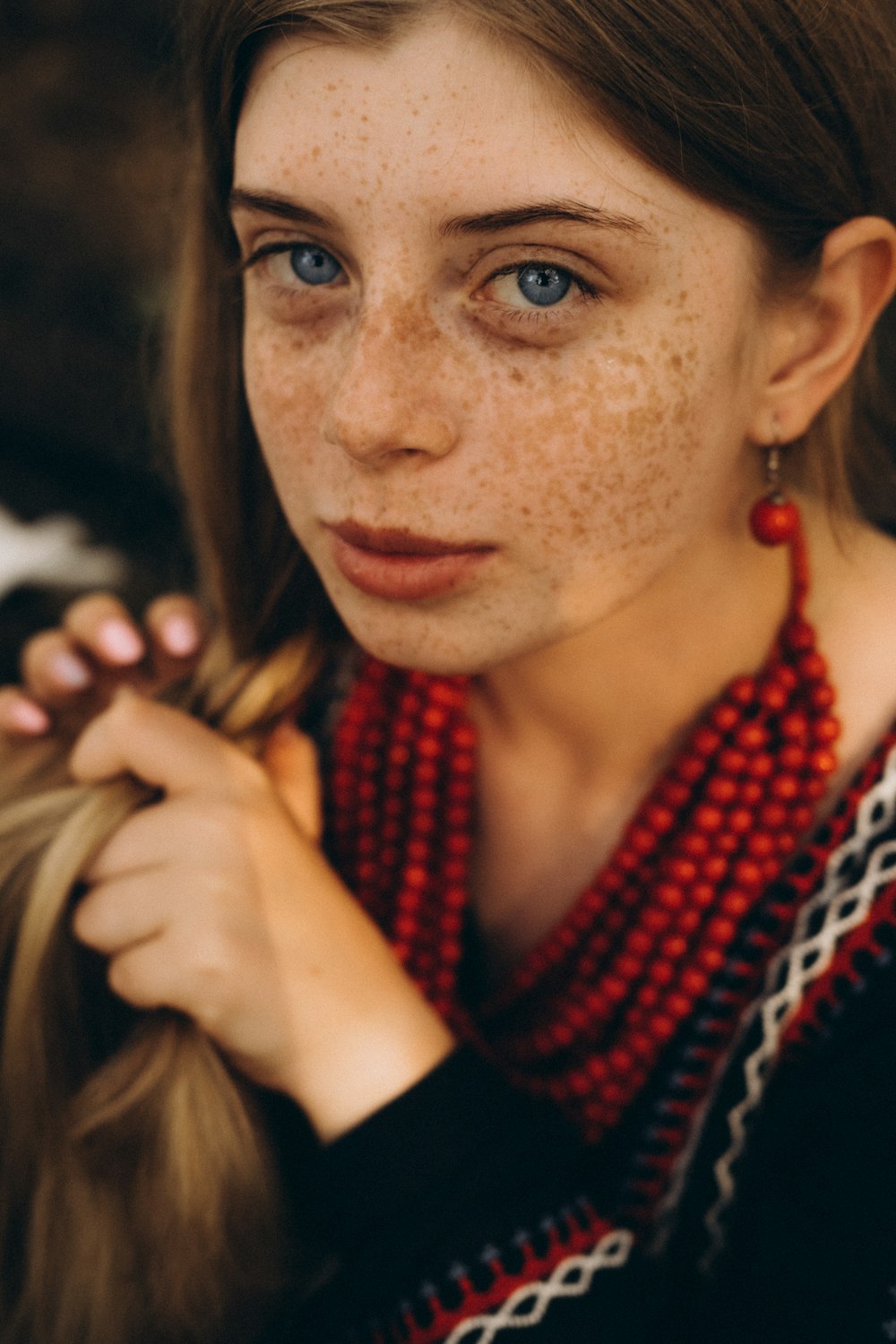 a woman with her hand on her chin