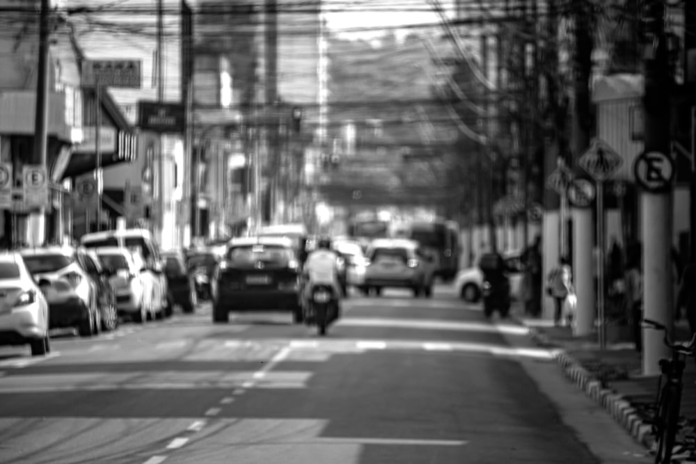 a busy street with cars and motorcycles