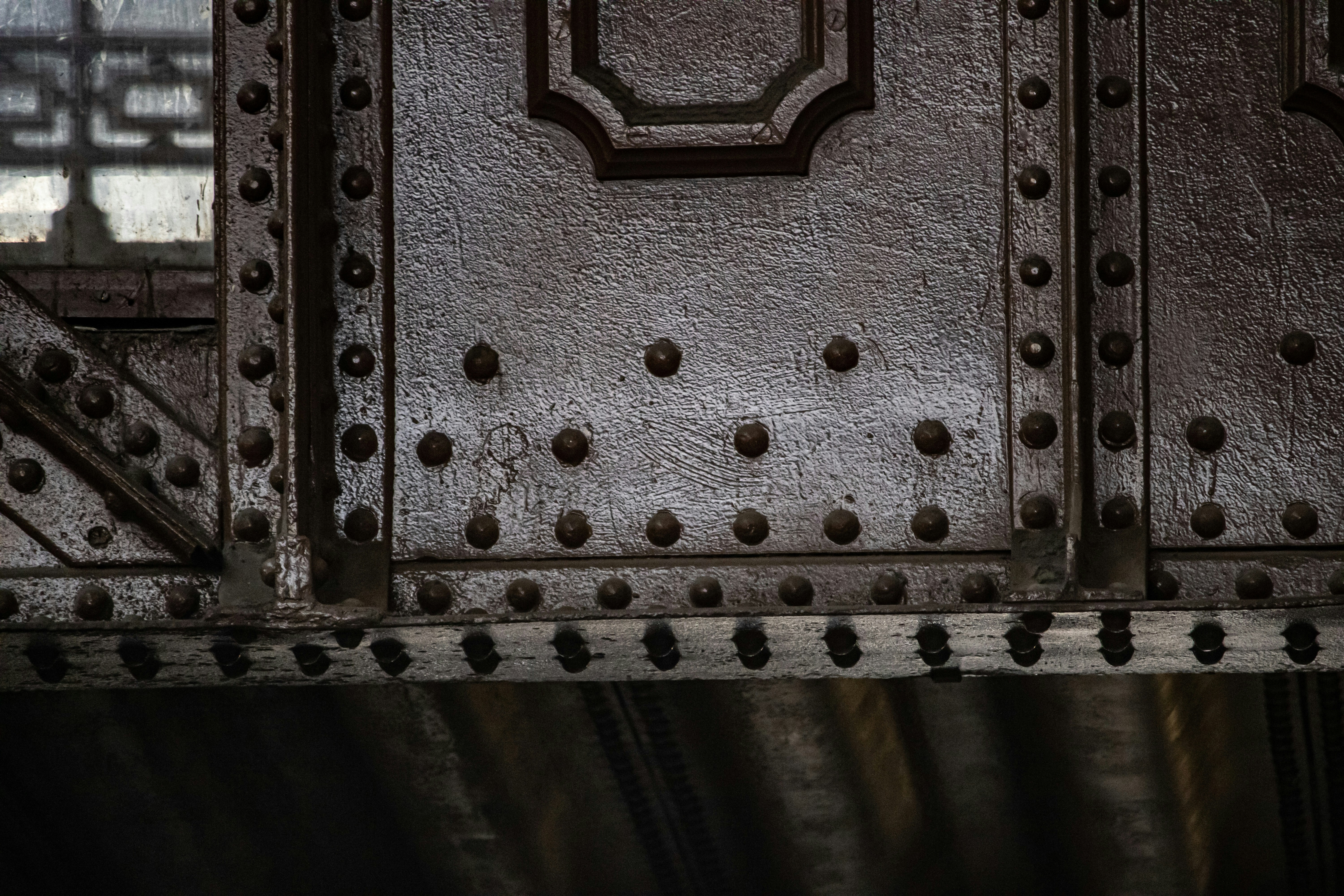 a metal surface with holes in it