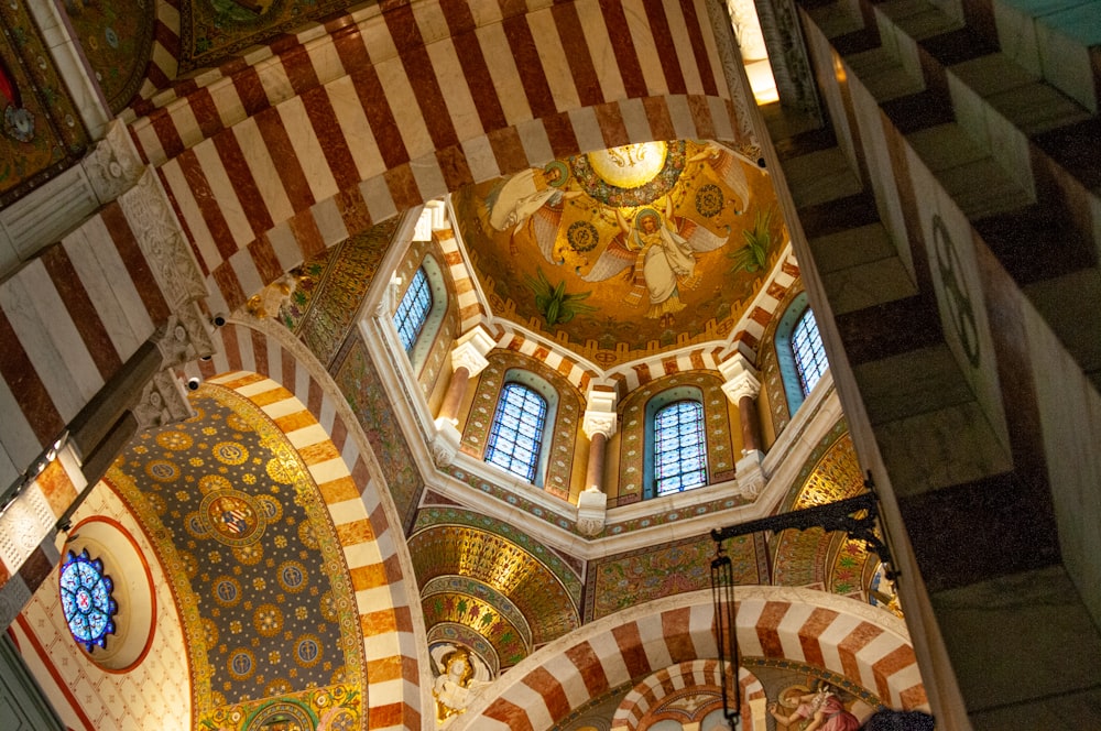 a large ornate room with stained glass windows