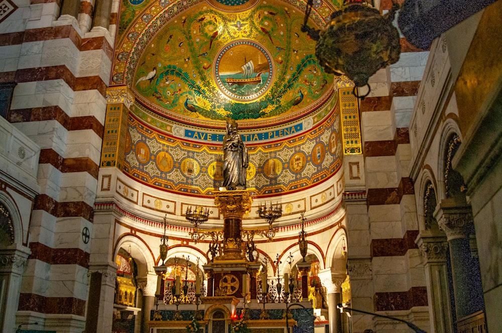 a large ornate ceiling with statues