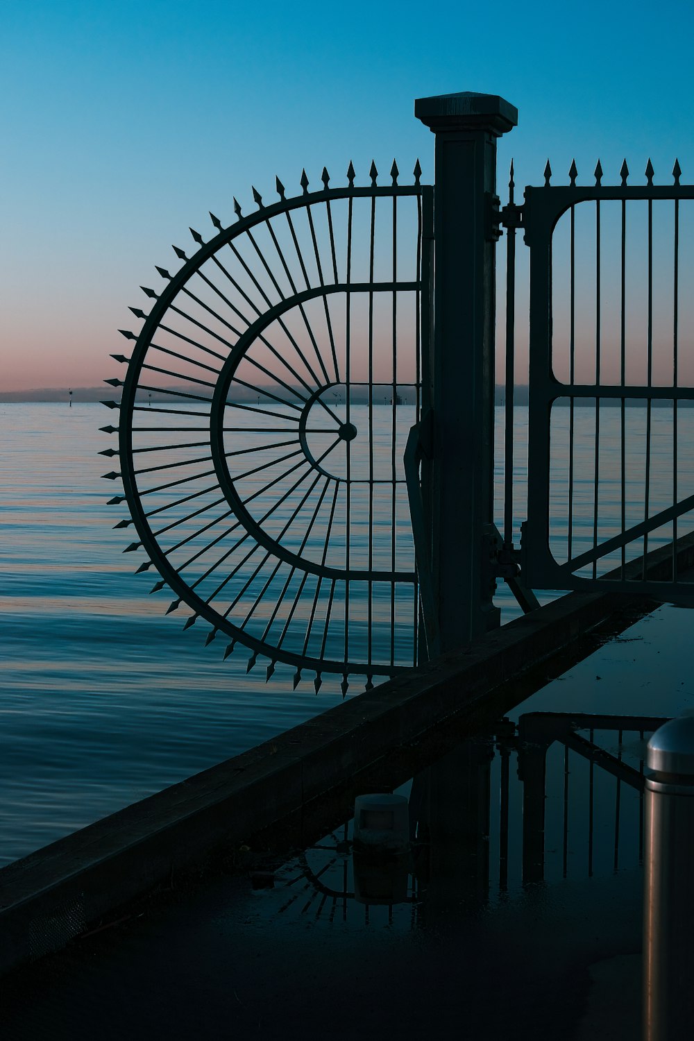 a metal gate with a bike design on it