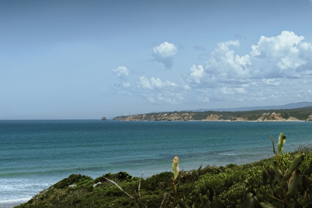 a body of water with land in the back