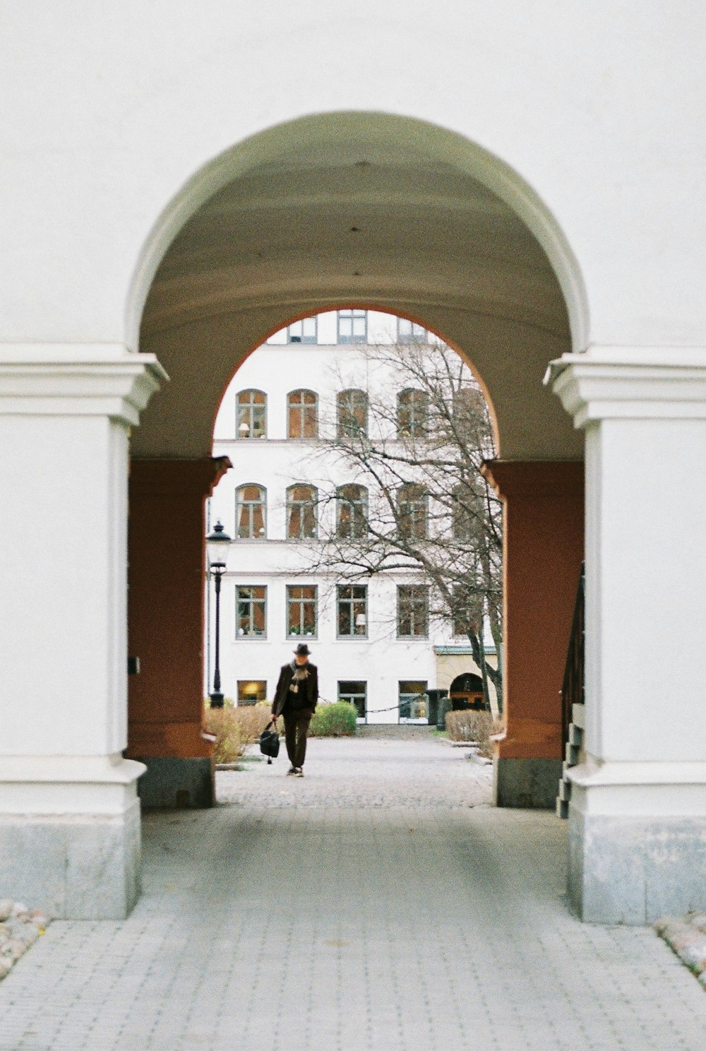 a person walking in a courtyard