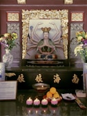 A serene altar adorned with candles and spiritual statues representing love and prosperity.