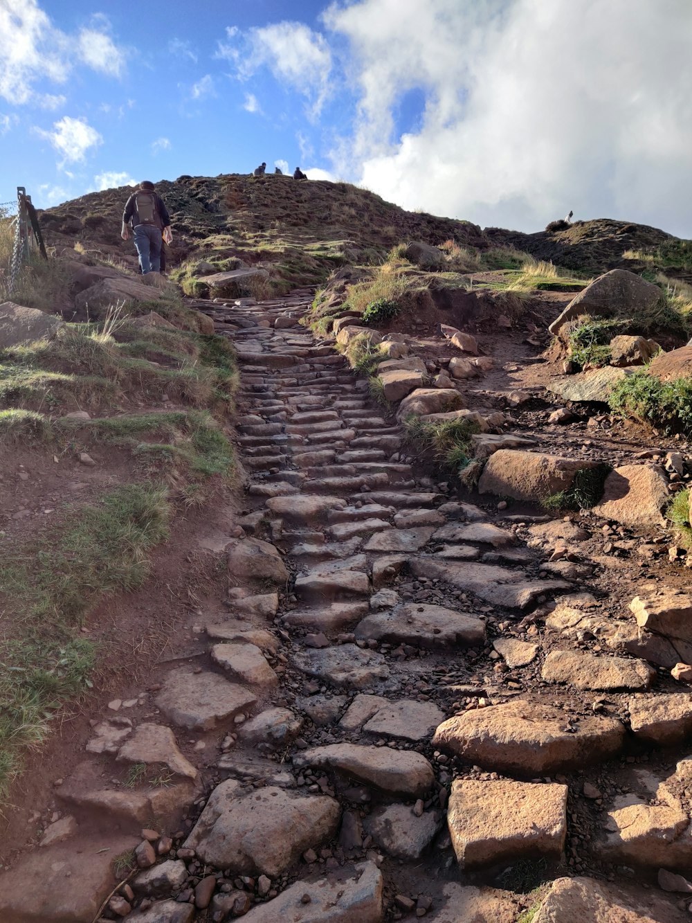 a person walking on a rocky path