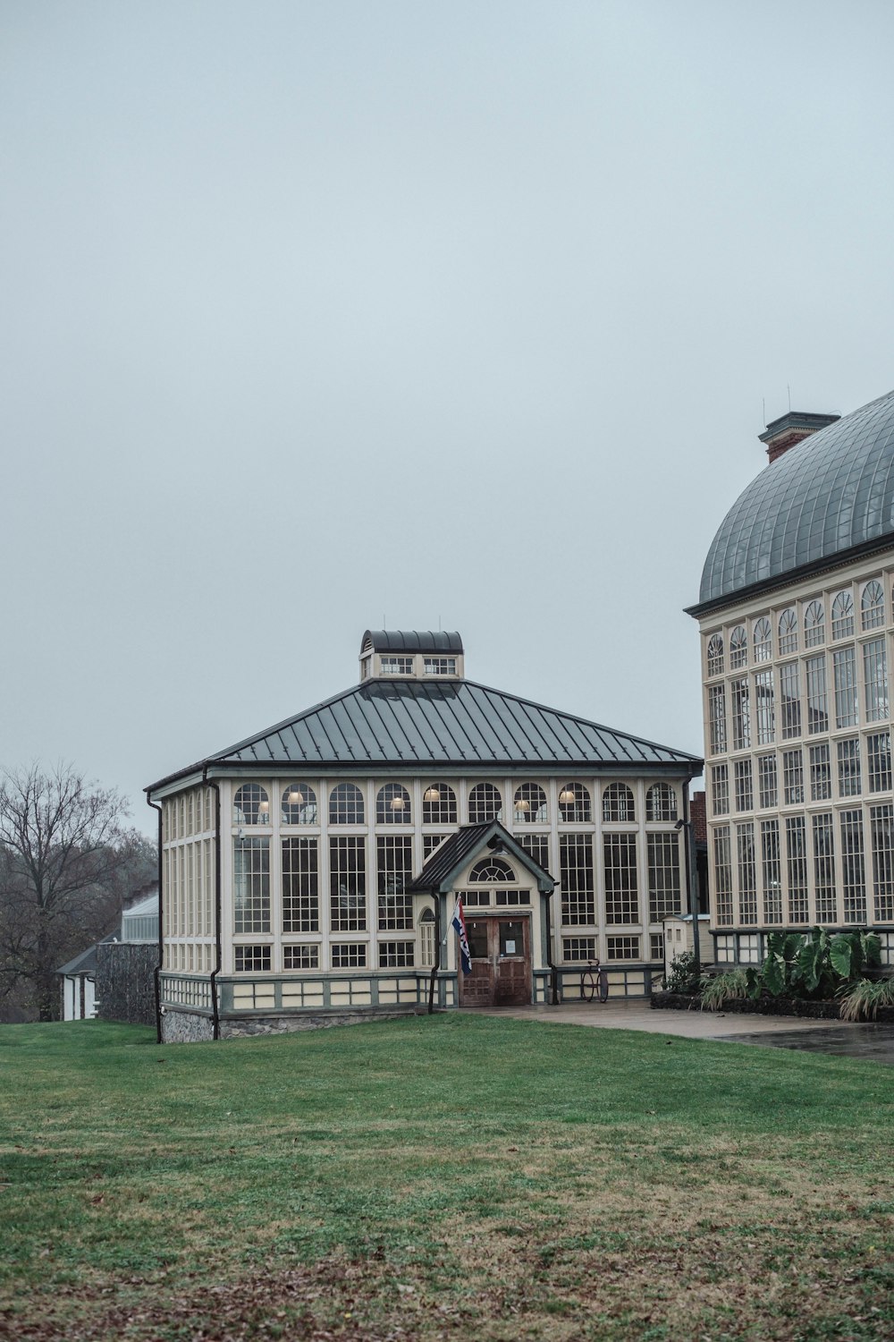 a large building with a domed roof in a field