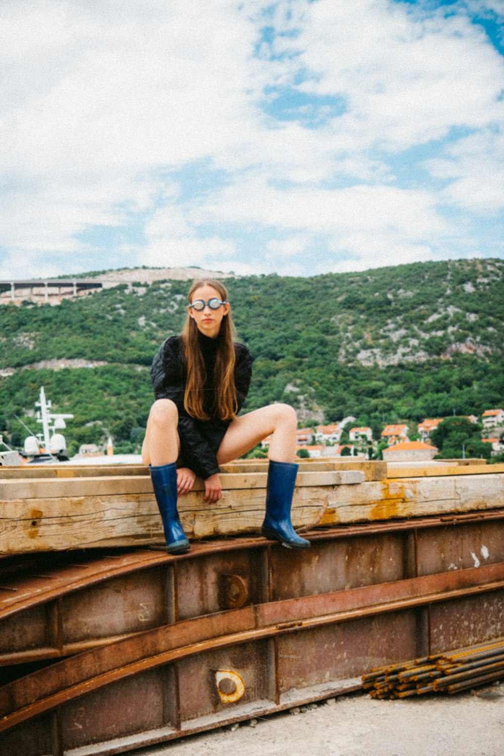 a person sitting on a railing