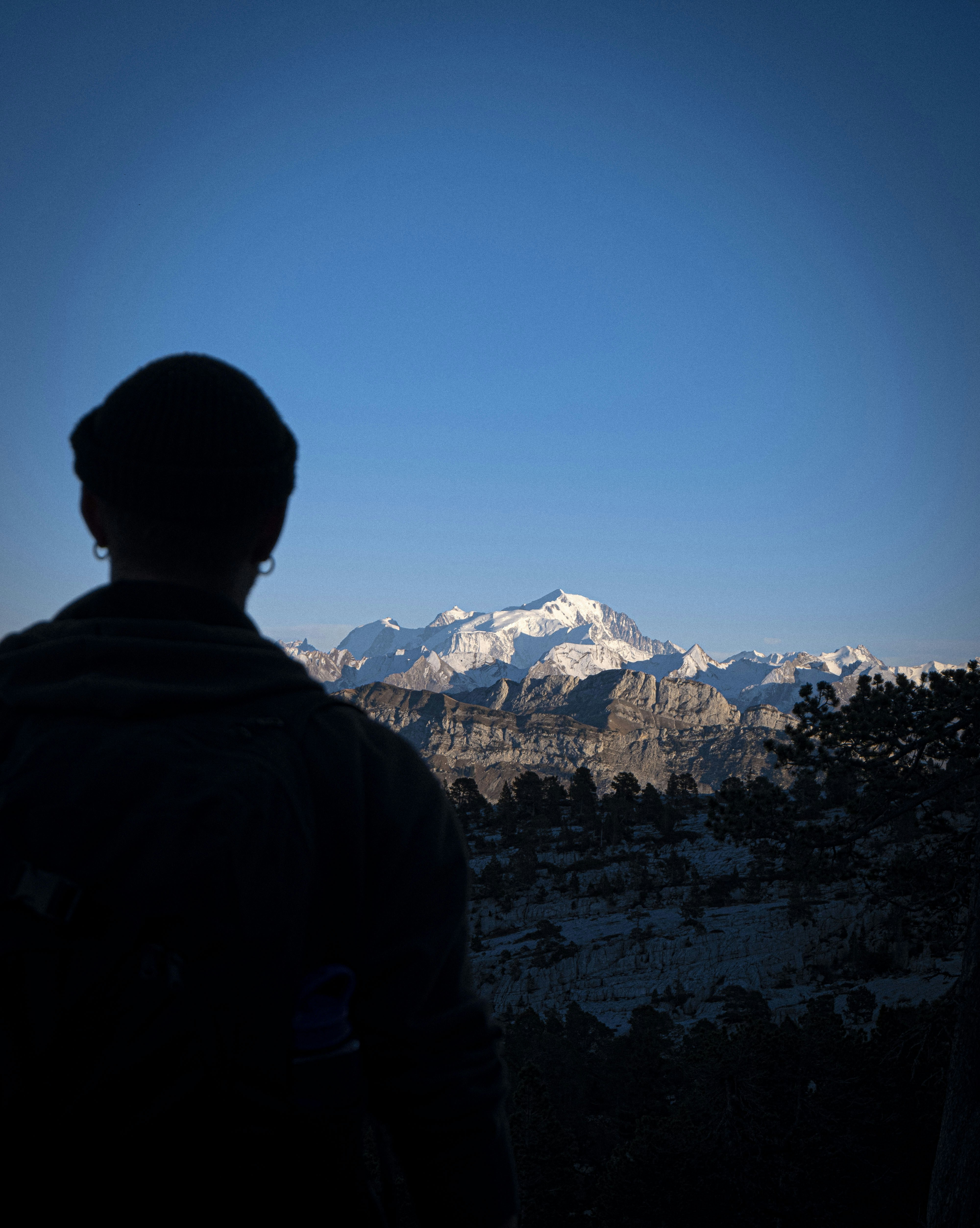 a person looking at a mountain