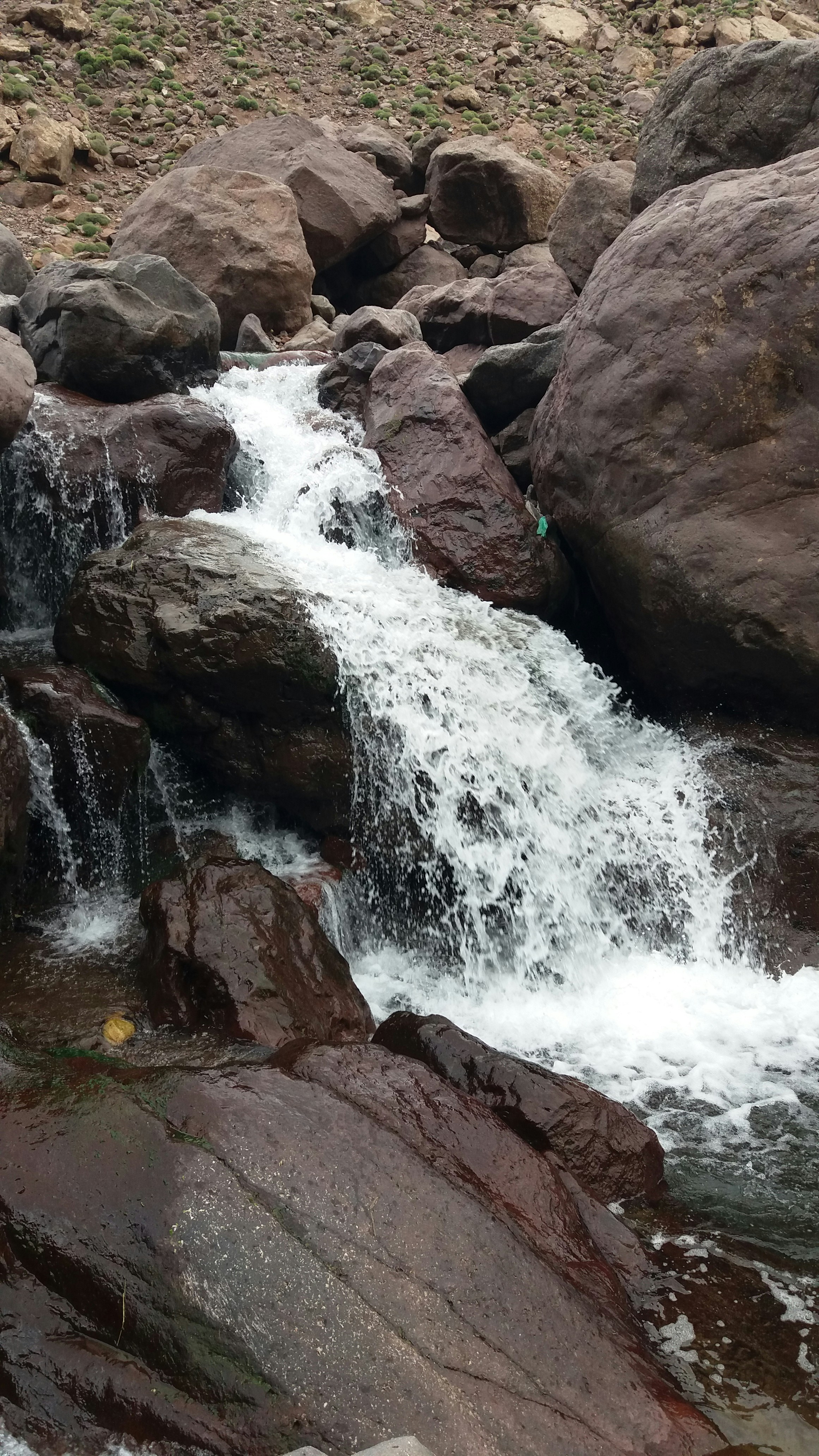 a small waterfall over rocks