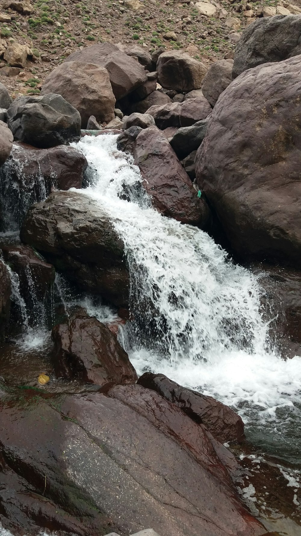 a small waterfall over rocks