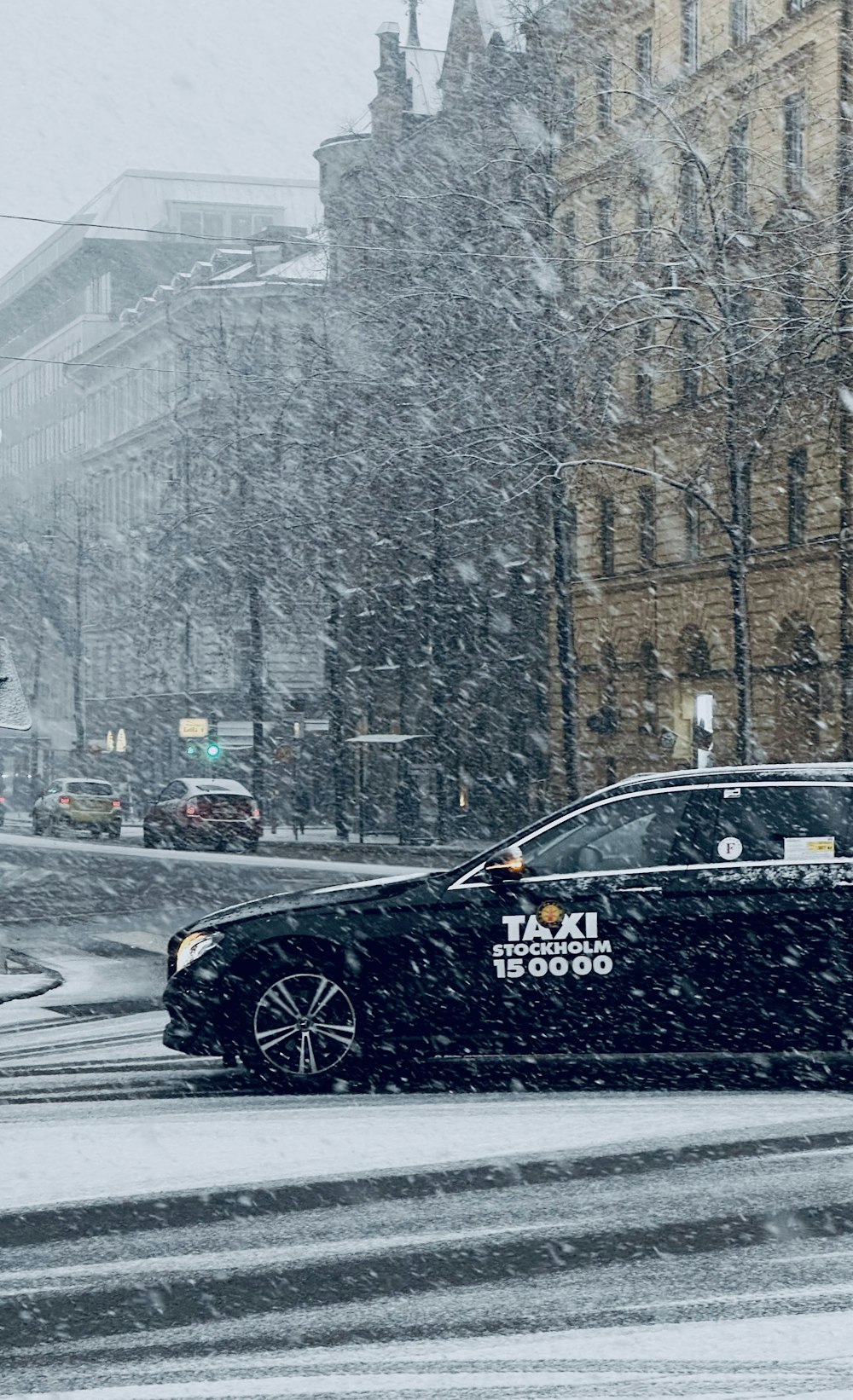 a black car on a snowy street