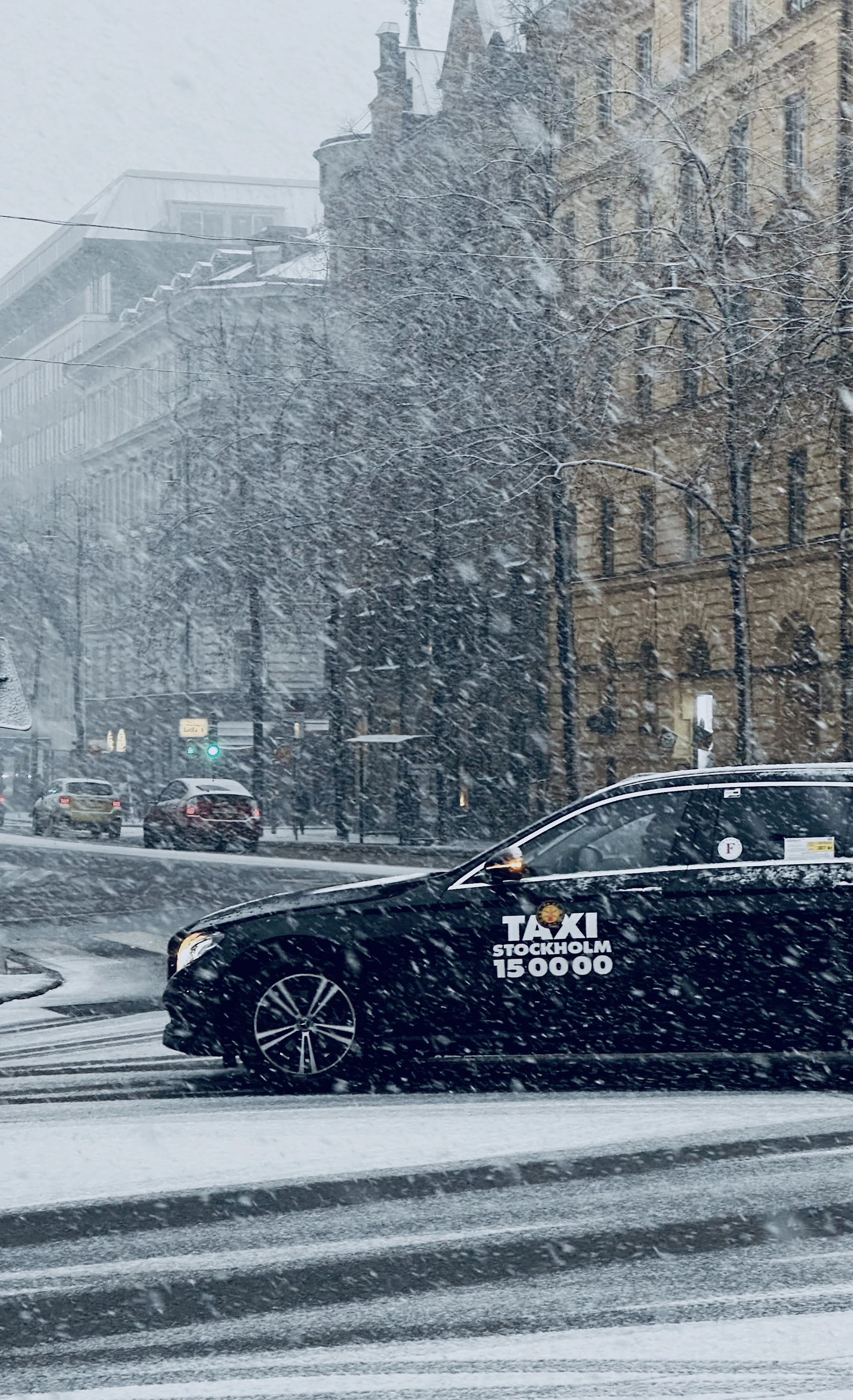 a black car on a snowy street