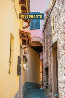 a narrow alley way with a sign