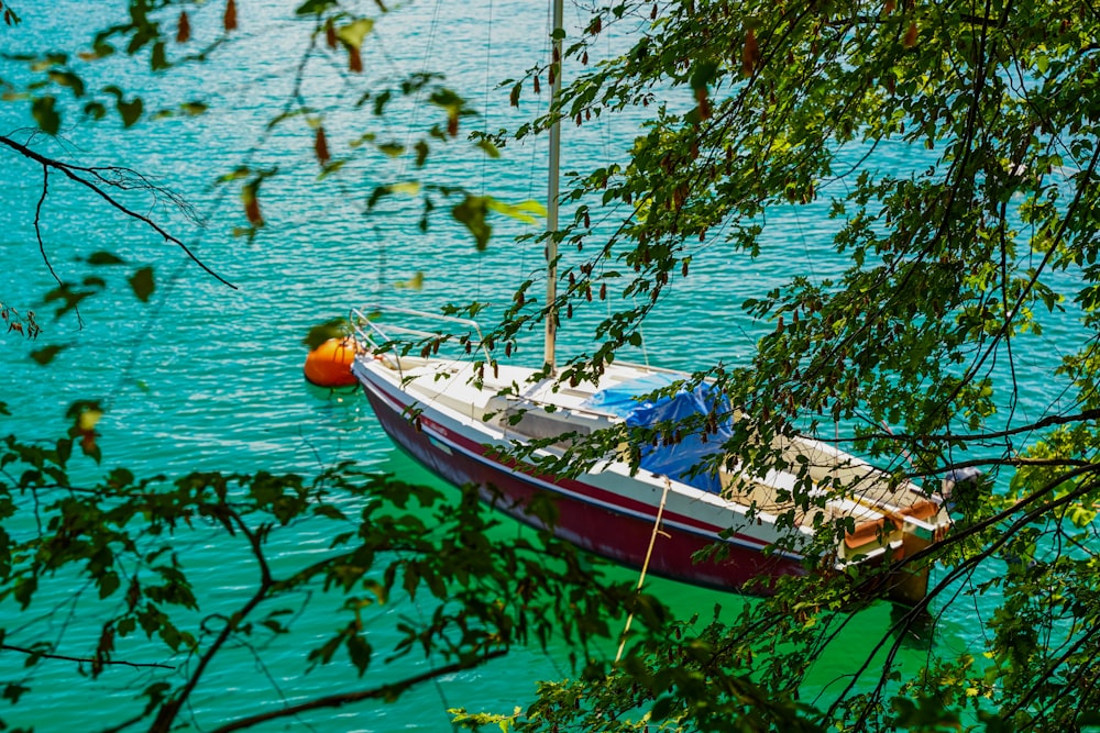 a boat sits in the middle of a lake