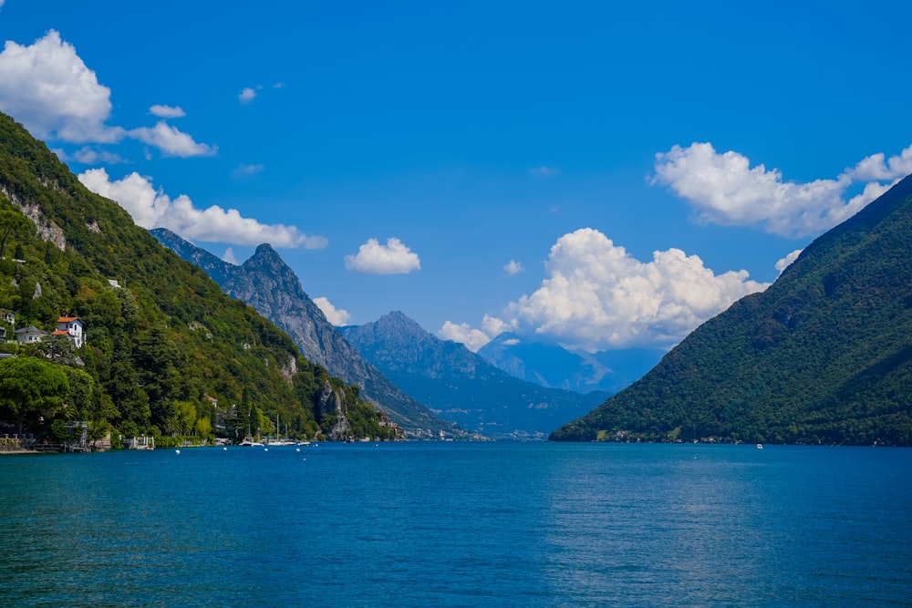 a body of water with mountains in the back