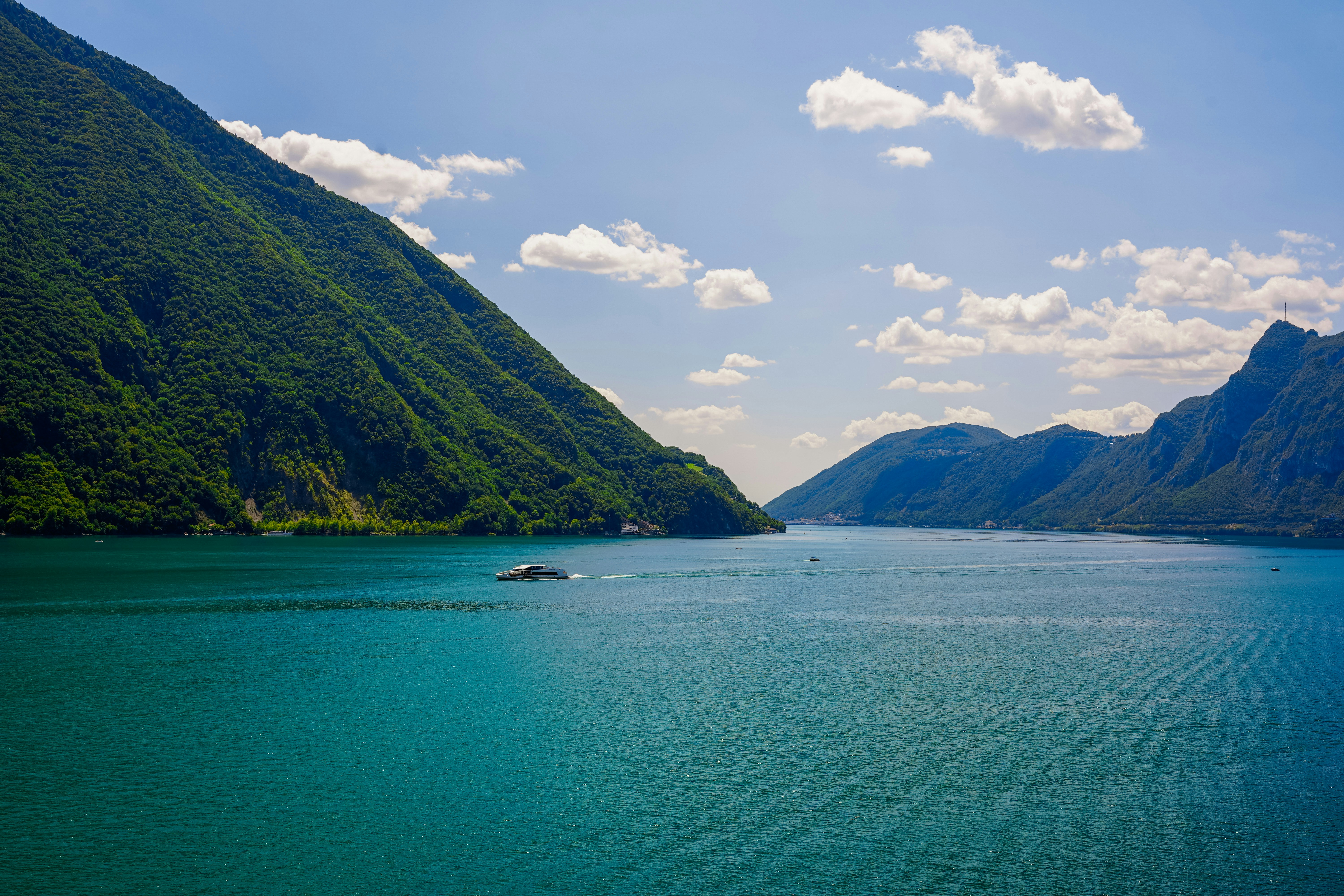 a body of water with mountains in the background