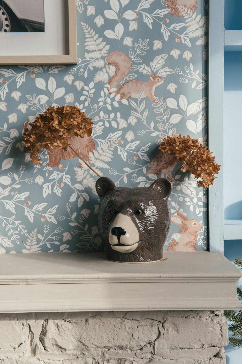 a stuffed animal on a window sill