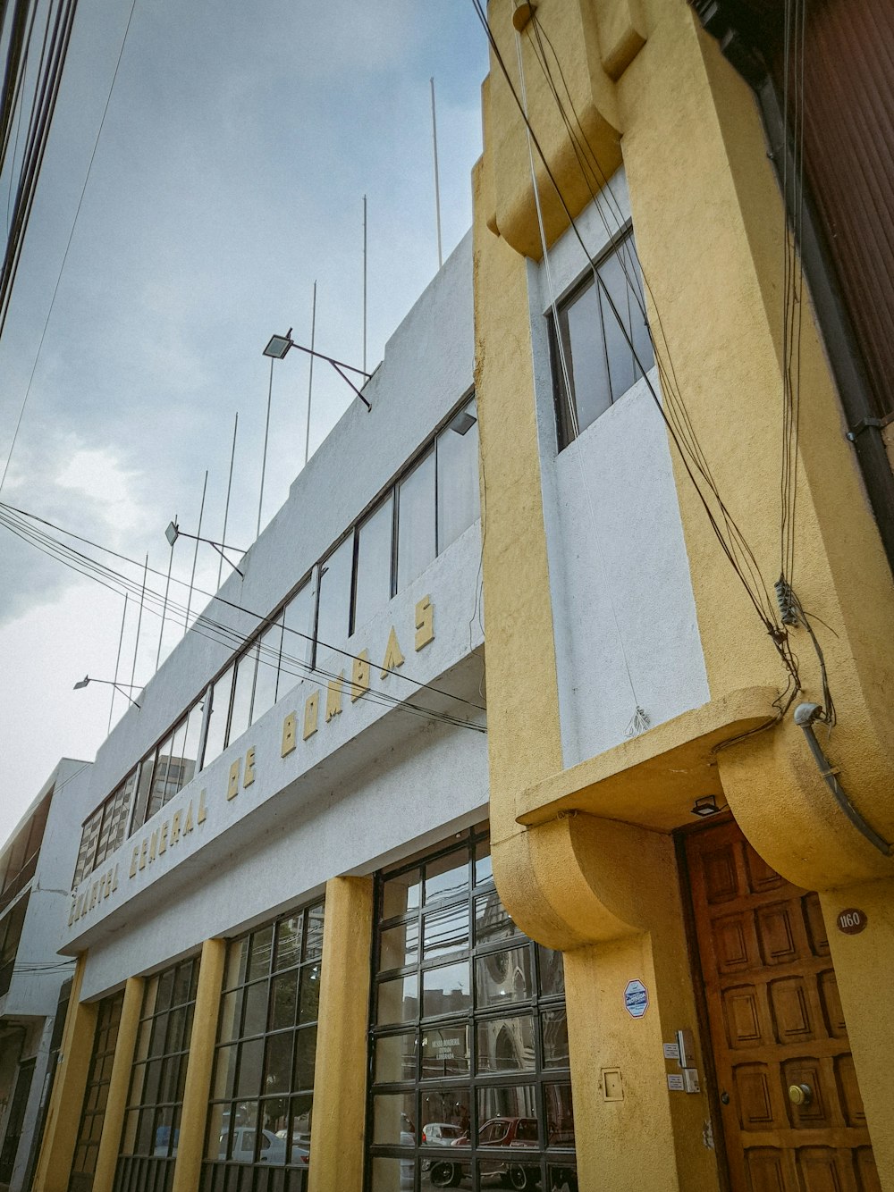 a building with a large yellow and white sign on it