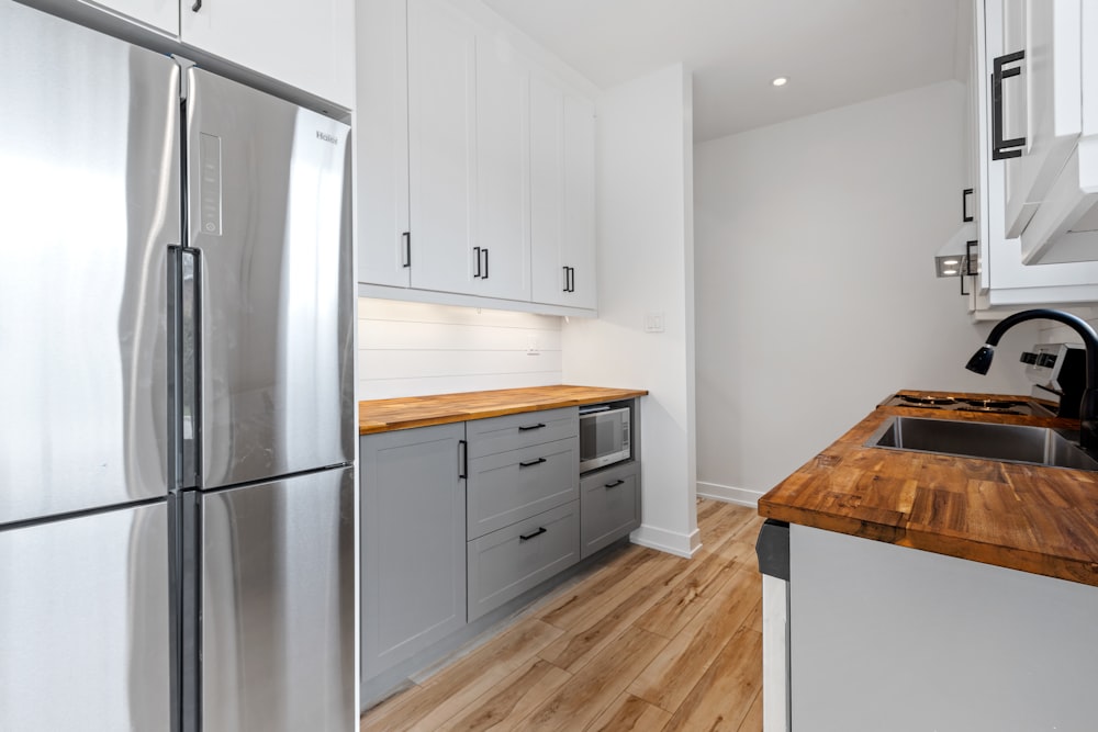 a kitchen with white cabinets