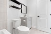 a bathroom with a toilet and sink