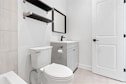 a bathroom with a toilet and sink