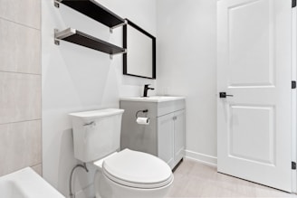 a bathroom with a toilet and sink