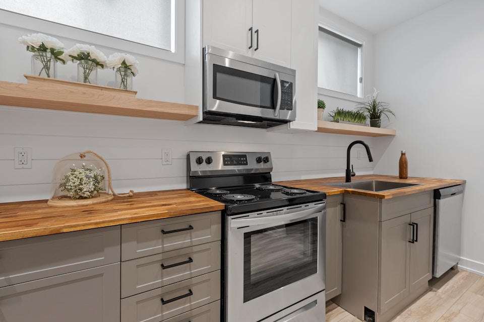 A kitchen with multiple appliances like a stove, microwave, and dishwasher
