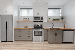 a kitchen with white cabinets