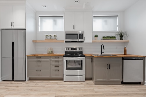 a kitchen with white cabinets