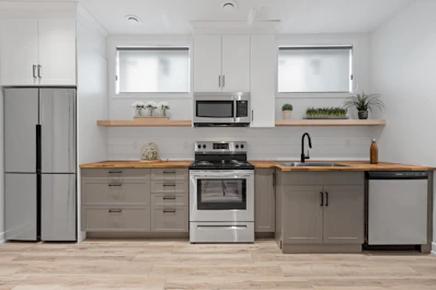 a kitchen with white cabinets