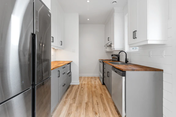 a kitchen with white cabinets