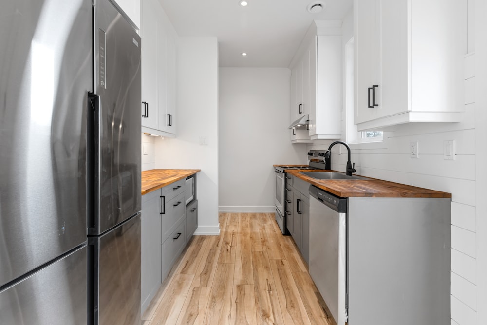 a kitchen with white cabinets