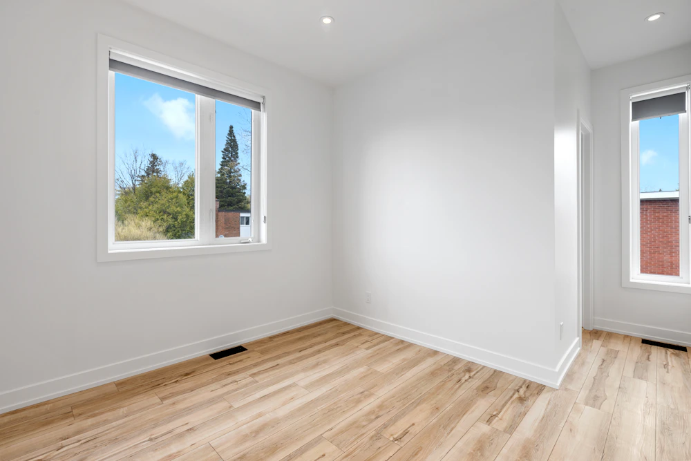 Remodeled room with hardwood flooring