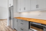 a kitchen with white cabinets