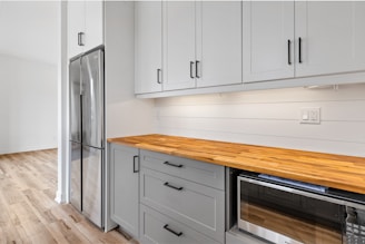 a kitchen with white cabinets