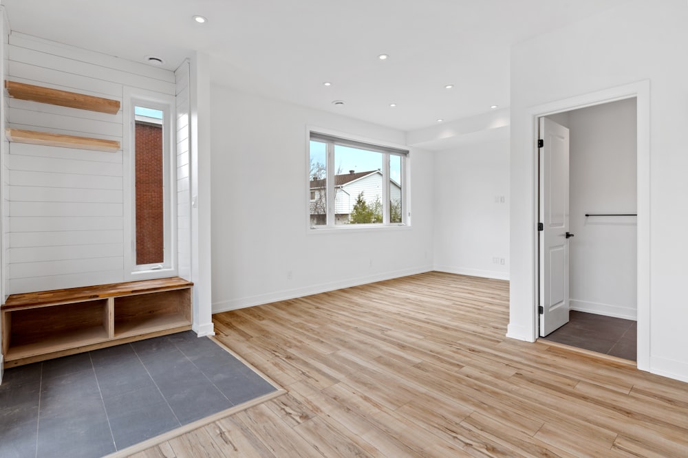 a room with a wood floor and a bench