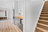 a kitchen with white cabinets